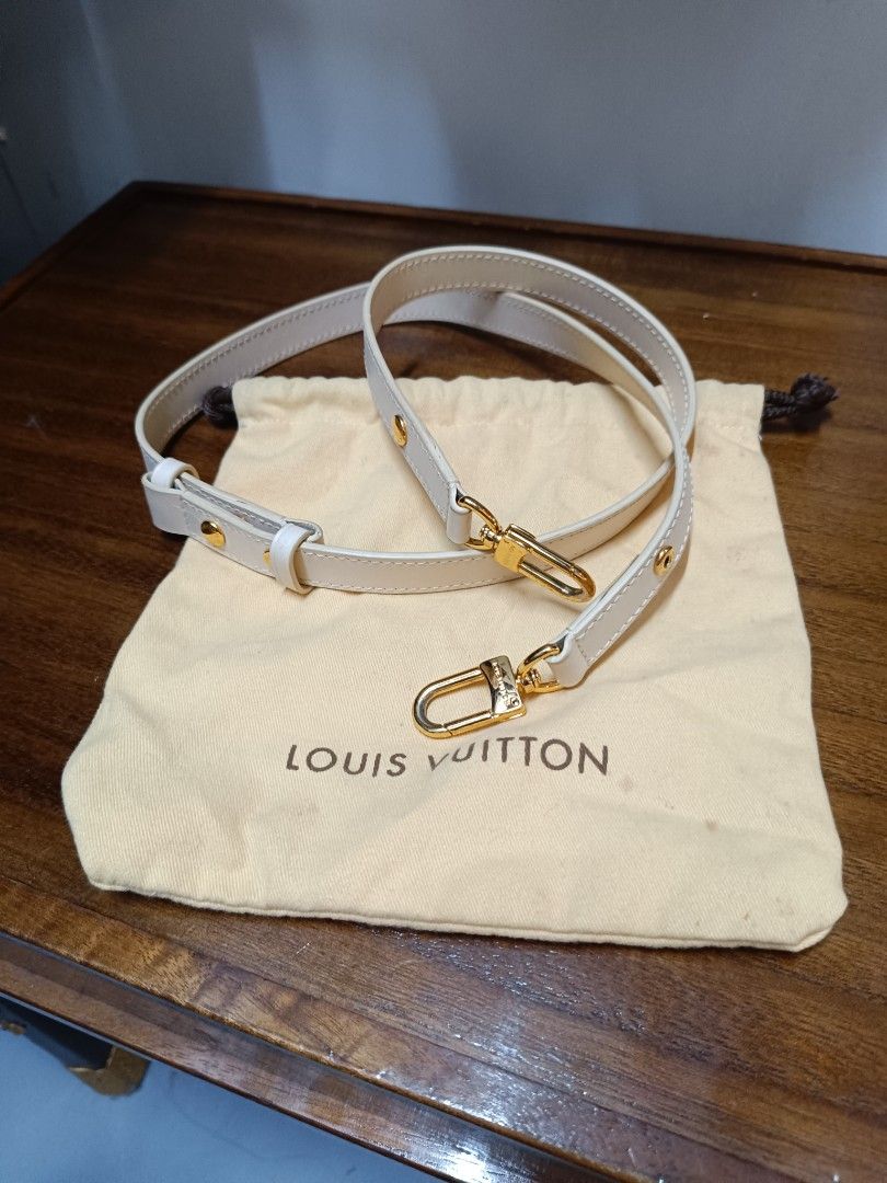 Louis Vuitton White Leather Bag Strap with Dust Bag (Category: Luxury Bags & Wallets) located in Pateros City. Submitted by harry062182 (Listing ID 1464979208, Image 1). Description: - White leather replacement strap designed for Louis Vuitton bags - Premium gold-tone hardware featuring engraved branding - Adjustable length with a secure buckle detail - Easy-to-use snap hooks on both ends - Includes a cream-colored Louis Vuitton dust bag - Clean 