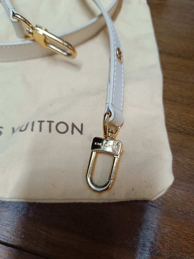 Louis Vuitton White Leather Bag Strap with Dust Bag (Category: Luxury Bags & Wallets) located in Pateros City. Submitted by harry062182 (Listing ID 1464979208, Image 2). Description: - White leather replacement strap designed for Louis Vuitton bags - Premium gold-tone hardware featuring engraved branding - Adjustable length with a secure buckle detail - Easy-to-use snap hooks on both ends - Includes a cream-colored Louis Vuitton dust bag - Clean 