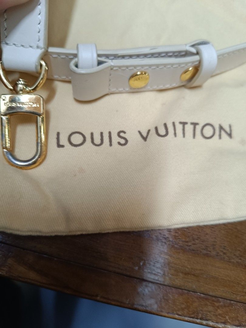 Louis Vuitton White Leather Bag Strap with Dust Bag (Category: Luxury Bags & Wallets) located in Pateros City. Submitted by harry062182 (Listing ID 1464979208, Image 3). Description: - White leather replacement strap designed for Louis Vuitton bags - Premium gold-tone hardware featuring engraved branding - Adjustable length with a secure buckle detail - Easy-to-use snap hooks on both ends - Includes a cream-colored Louis Vuitton dust bag - Clean 