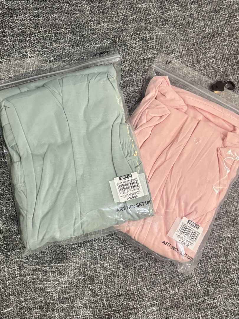 Lounge Set Shirt and Shorts (Category: Sets or Coordinates) located in Mandaluyong City. Submitted by kthln (Listing ID 1465070817, Image 2). Description: - Brand: Surplus - Quantity: 2 pairs (Green and Pink) - Size: Medium (M) - Includes: Short-sleeve shirt and shorts with drawstring waist per set - Material: Soft and comfortable fabric - Condition: Brand new with tags in original ziplock packaging Price: 399 PHP each Take both for 750.