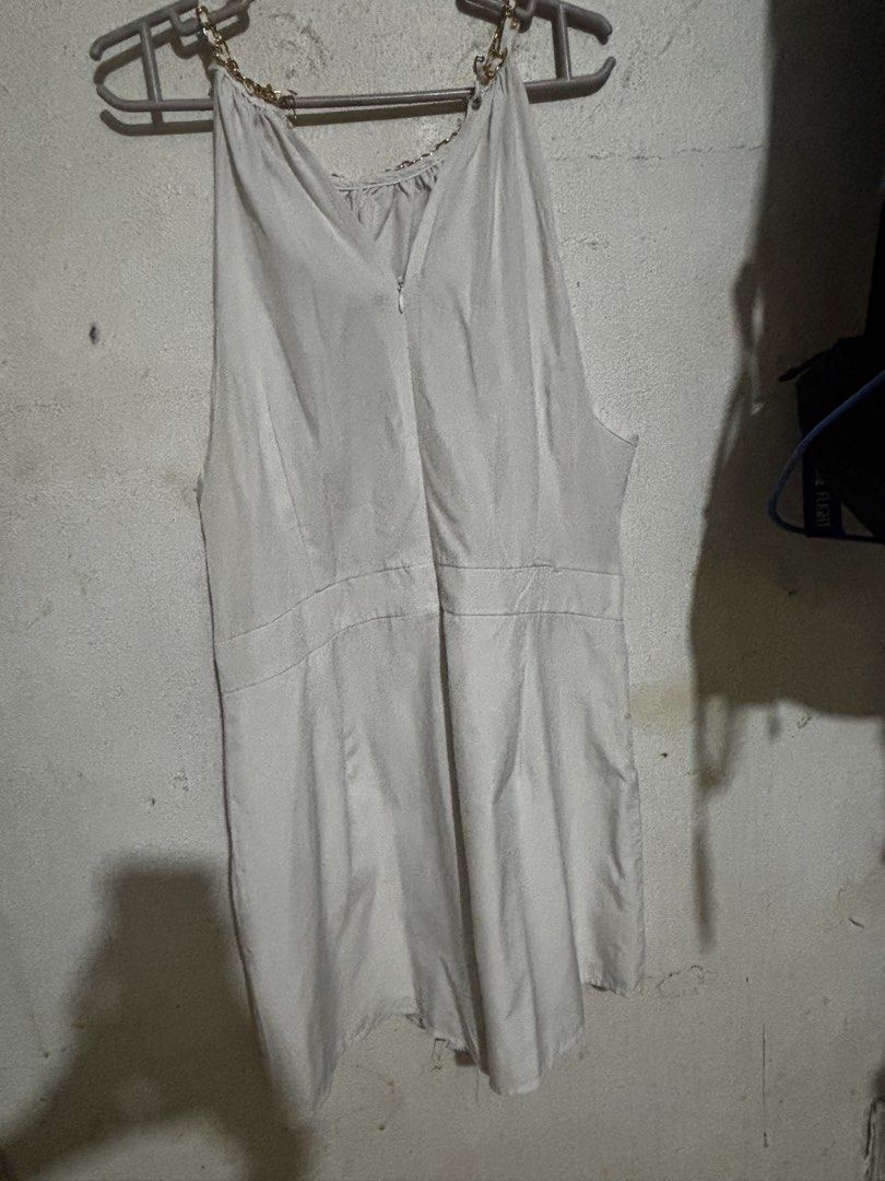 Lovito Women Elegant Plain Metal Basic Jumpsuit (White) (Category: Rompers) located in Mabalacat. Submitted by dj10016 (Listing ID 1464995050, Image 2). Description: - Brand: Lovito - Size: L (EU 38, US 8) - Color: White - Design: Halter neck with gold chain detail, pleated front bodice, fitted waistband, and flared shorts - Closure: Back zipper - Material: Lightweight and easy to style - Condition: Worn twice, excellent shape.
