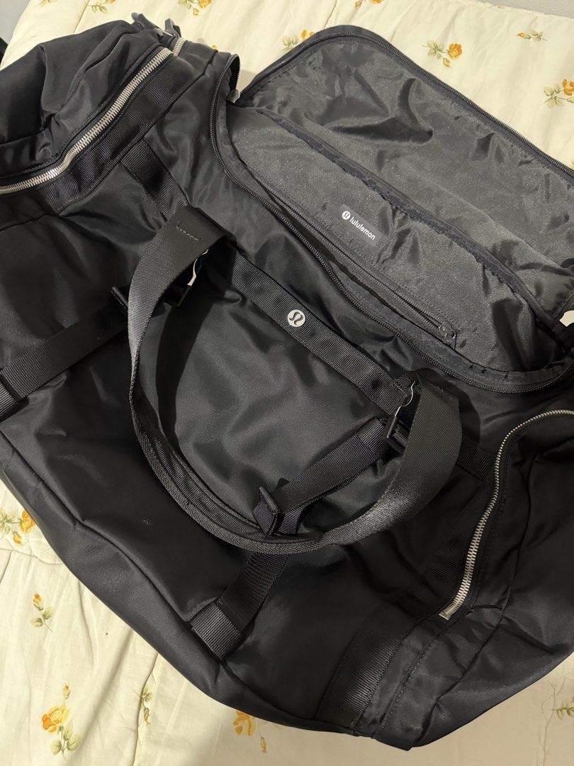 Lululemon Black Travel Duffel Bag (Category: Sling Bags) located in Davao. Submitted by arbeepogio63169 (Listing ID 1465010774, Image 1). Description: - Authentic black Lululemon duffel bag - Ideal size for gym sessions, sports, or short trips (55 x 27.5) - Sturdy, high-quality nylon material for long-lasting use - Multiple zippered compartments inside and out for ultimate organization - Branded metal zipper pulls and interior Lululemon logo patc