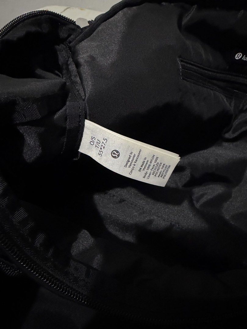 Lululemon Black Travel Duffel Bag (Category: Sling Bags) located in Davao. Submitted by arbeepogio63169 (Listing ID 1465010774, Image 3). Description: - Authentic black Lululemon duffel bag - Ideal size for gym sessions, sports, or short trips (55 x 27.5) - Sturdy, high-quality nylon material for long-lasting use - Multiple zippered compartments inside and out for ultimate organization - Branded metal zipper pulls and interior Lululemon logo patc