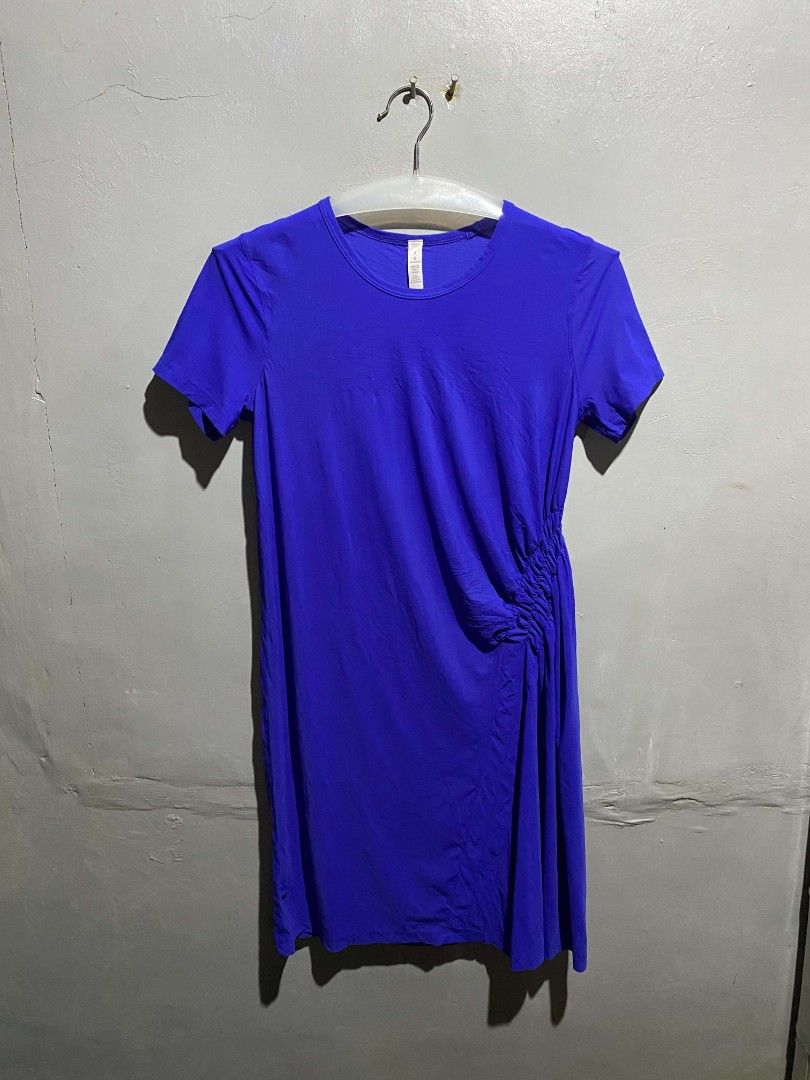 Lululemon Blue Athletic Dress Size 6 (Category: Dresses) located in Manila. Submitted by bravefalcon-fabccf (Listing ID 1465094211, Image 2). Description: - Brand: Lululemon - Style: Athletic dress - Color: Vibrant blue - Size: 6 (tag attached) - Material: Nylon and lycra elastane blend - Design: Short sleeves, round neckline, midi length - Special Features: Unique side ruching on the left hip and reflective logo near the bottom hem.