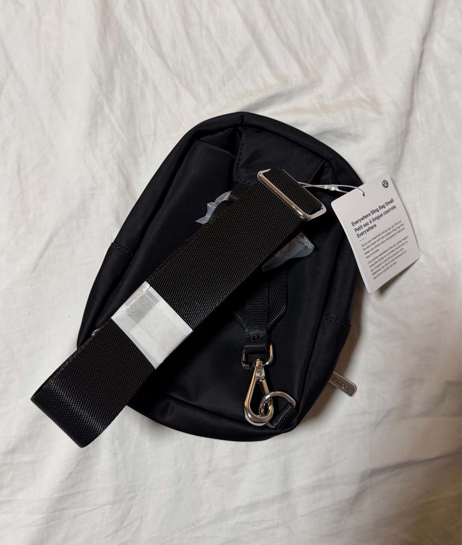 Lululemon Everywhere Sling Bag Small 2L Black (Category: Cross-body Bags) located in Quezon City. Submitted by jasongos (Listing ID 1465003377, Image 3). Description: Lululemon Everywhere Sling Bag Small 2L in classic black. Compact size with 2 litres capacity, zip-up main compartment, and front pocket. Adjustable strap with secure buckle hardware. Interior mesh slip pocket. Brand new condition with original store tags attached. Unused, protectiv