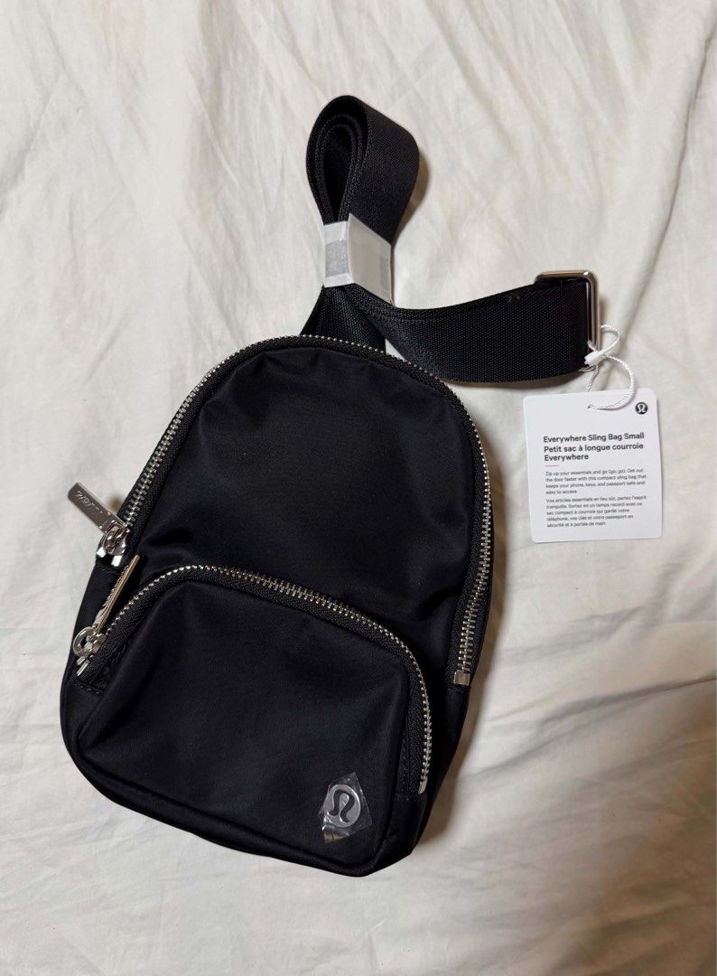 Lululemon Everywhere Sling Bag Small 2L Black (Category: Cross-body Bags) located in Quezon City. Submitted by jasongos (Listing ID 1465003377, Image 1). Description: Lululemon Everywhere Sling Bag Small 2L in classic black. Compact size with 2 litres capacity, zip-up main compartment, and front pocket. Adjustable strap with secure buckle hardware. Interior mesh slip pocket. Brand new condition with original store tags attached. Unused, protectiv