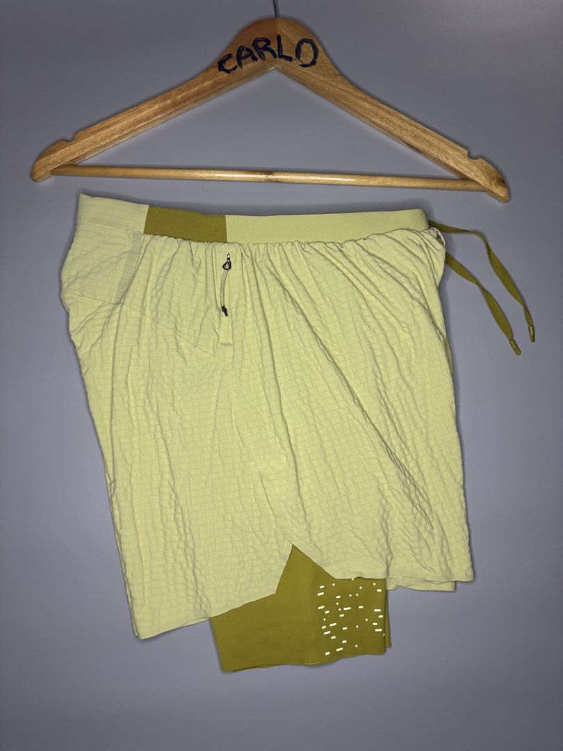 LULULEMON SURGE LINED SHORT 6 "SPECIAL EDITION (Category: Shorts) located in Bayambang. Submitted by lo_keythrifting (Listing ID 1465007861, Image 2). Description: ✅ LULULEMON SURGE LINED SHORT 6 "SPECIAL EDITION - Condition: Good as new condition - Waist: 26-34 - Length: 13 - Color rate: 10/10 - No issue - Dual-layer design: Light yellow-green grid-textured outer layer and darker olive yellow inner liner with perforated dots - Elastic waistband 