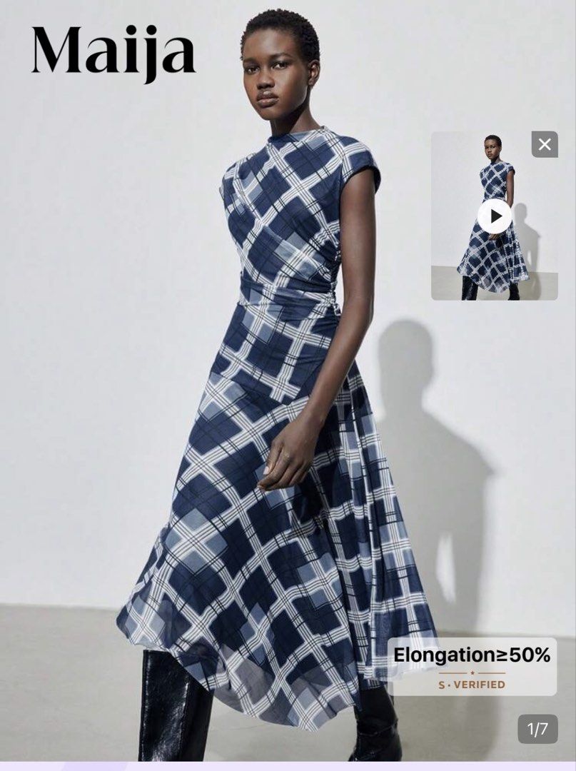 Maija Blue Plaid Midi Dress (Category: Dresses) located in Pasig City. Submitted by jnzmrq1003 (Listing ID 1464978787, Image 2). Description: - Brand/Style: Maija blue and white plaid midi dress - Neckline & Sleeves: High neckline with short cap sleeves - Fit & Silhouette: Fitted waistline with an asymmetrical draped skirt and flowing silhouette - Fabric: Lightweight material with a semi-sheer overlay - Styling Tip: Looks great paired with tall b