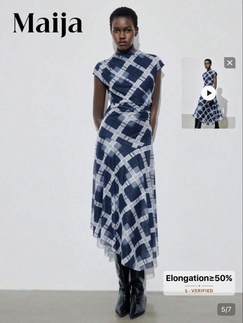 Maija Blue Plaid Midi Dress (Category: Dresses) located in Pasig City. Submitted by jnzmrq1003 (Listing ID 1464978787, Image 3). Description: - Brand/Style: Maija blue and white plaid midi dress - Neckline & Sleeves: High neckline with short cap sleeves - Fit & Silhouette: Fitted waistline with an asymmetrical draped skirt and flowing silhouette - Fabric: Lightweight material with a semi-sheer overlay - Styling Tip: Looks great paired with tall b
