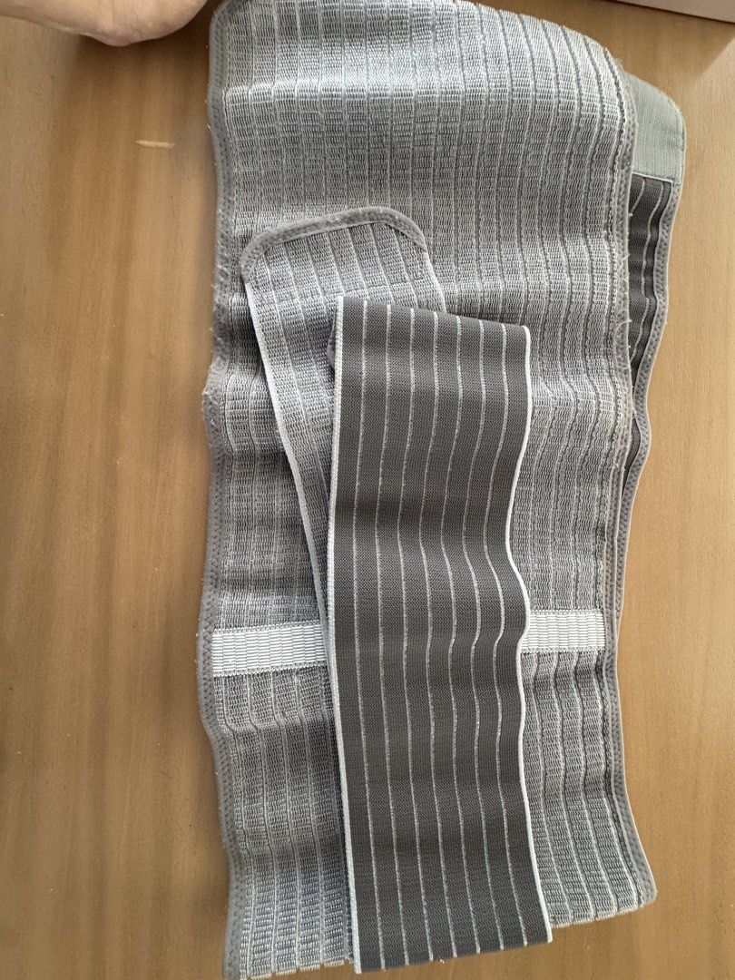 Mamaway Postpartum Belly Wrap Grey Abdominal Binder (Category: Maternity Care) located in San Fernando. Submitted by jelajoybasco (Listing ID 1464984327, Image 2). Description: - Brand: Mamaway - Color: Grey - Condition: Clean and ready for use - Features: Adjustable strap with secure velcro closure - Material: Ribbed elastic fabric designed to support core recovery after delivery.