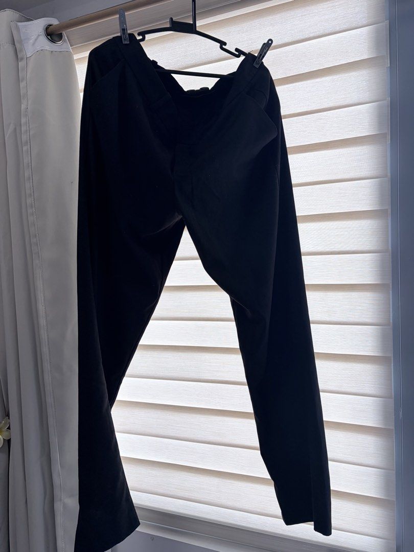 Mango Black formal trousers pants slacks workwear (Category: Coats, Jackets and Outerwear) located in Manila. Submitted by cheska.closet18 (Listing ID 1465023549, Image 1). Description: - Color: Classic solid black - Fit: Standard straight leg cut, standard sizing - Closure: Hook and bar waistband with a secure zippered fly - Material: Comfortable fabric with minimal stretch - Versatility: Perfect for office wear, interviews, and formal occasions