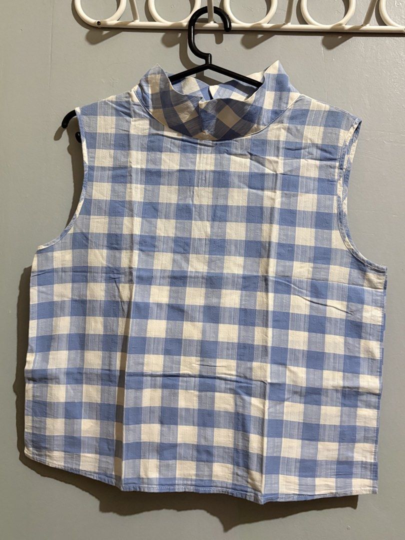 MANGO Blue and White Gingham Sleeveless Mock Neck Blouse (Category: Sleeveless) located in Manila. Submitted by margascloset_ (Listing ID 1465076401, Image 1). Description: MANGO Blue and white gingham pattern sleeveless design with mock neckline and structured collar - can fit XXS/XS - Back keyhole opening with a single small button closure - Condition: lightly used & pre-loved RFS: Decluttering MOD: J&t, LBC, Lalamove, Grab MOP: Gcash / Bank.