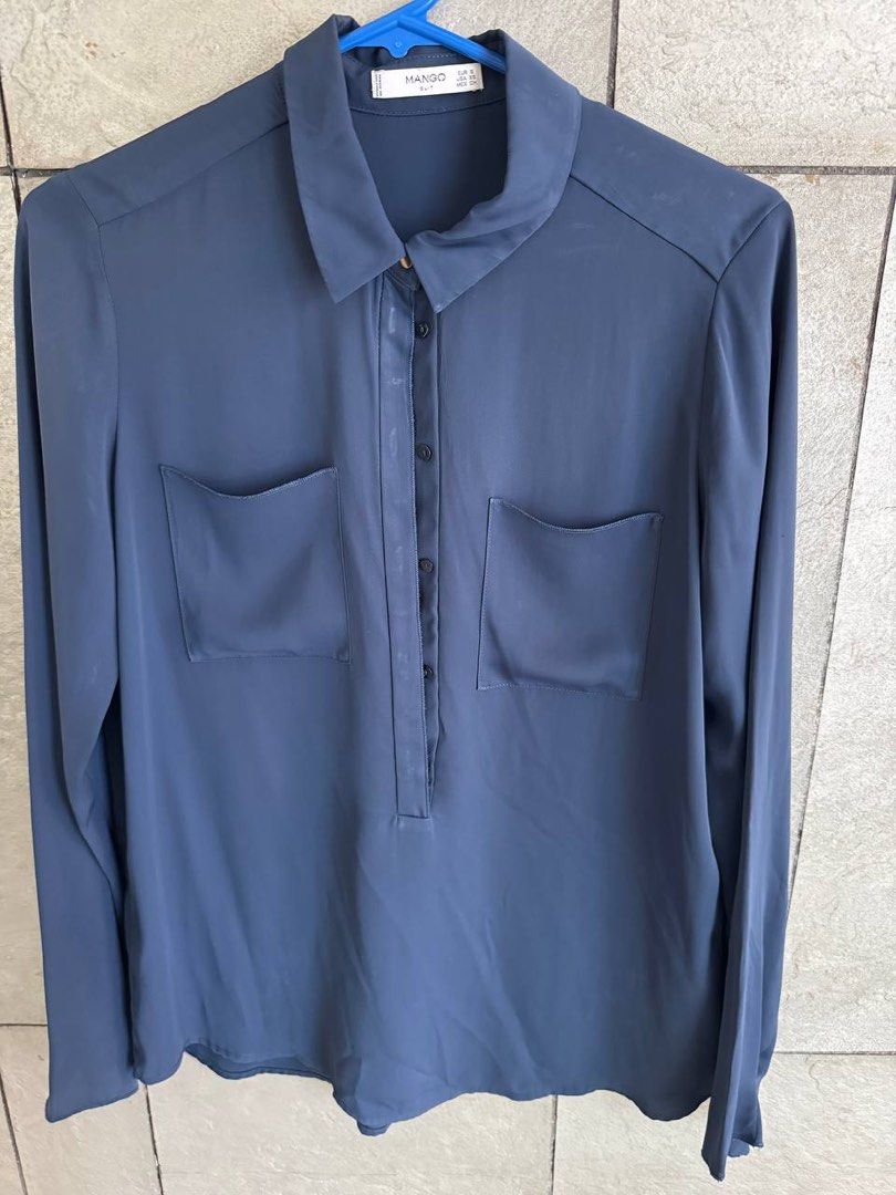 Mango Suit Blue Long Sleeve Button Up Blouse (Category: Longsleeves) located in Taguig. Submitted by anxmz (Listing ID 1465043342, Image 1). Description: - Brand: Mango Suit - Color: Blue - Size: EUR S / USA XS - Style: Long sleeves with classic collar and button-up front - Details: Two stylish front flap pockets - Fabric: Smooth and lightweight for all-day comfort - Condition: Excellent pre-loved or brand new (as applicable) - Mode of Payment: G