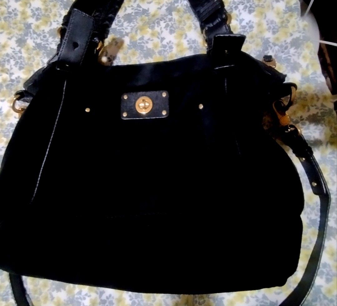 Marc by Marc Jacobs Black Shoulder Bag (Category: Cross-body Bags) located in Manila. Submitted by lene48 (Listing ID 1465050131, Image 2). Description: - Brand: Marc by Marc Jacobs - Color: Classic black with gold-tone hardware - Closure: Zip top with engraved pull & front turn-lock plaque - Details: Chic stud accents & Made in Indonesia interior tag - Interior: Signature black and white logo fabric lining - Straps: Dual top handles and includes