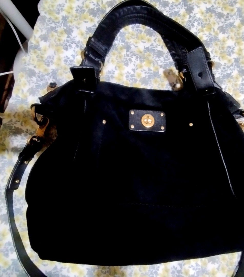 Marc by Marc Jacobs Black Suede Shoulder Bag (Category: Cross-body Bags) located in Manila. Submitted by lene48 (Listing ID 1465077587, Image 2). Description: - Brand: Marc by Marc Jacobs - Material: Luxurious black suede with gold-tone hardware - Versatile Carry: Includes dual leather handles and a detachable strap - Secure Storage: Top zip closure and front turn-lock pocket - Interior: Roomy main compartment with patterned lining and zip pocket