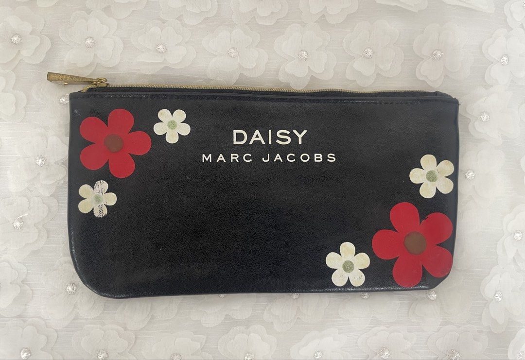 Marc Jacobs Daisy Black Floral Pouch Makeup Bag (Category: Purses & Pouches) located in Las Pinas. Submitted by qcleopatrastrove (Listing ID 1464979734, Image 1). Description: *Compact size, ideal for daily makeup essentials or travel storage Please manage your expectations. Thank you.🤎.