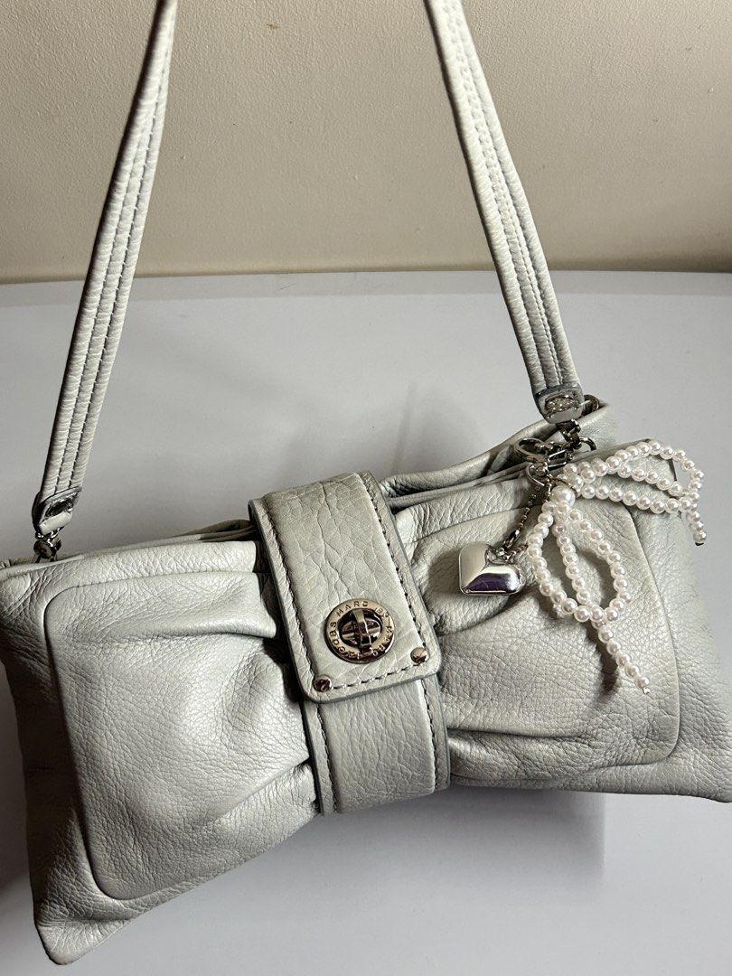 Marc Jacobs Turnlock Bow Bag (Category: Shoulder Bags) located in Manila. Submitted by cindylou_ (Listing ID 1465027336, Image 1). Description: 💋 last price! 💋 such a cutie bag 🎀 💋 detachable strap 💋 has a small stain at the bag (dot) unnoticeable 📍Manila .