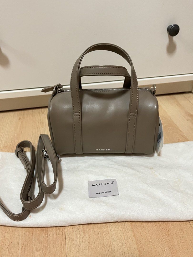 MARHEN.J Bella Mini Bag in Taupe (Category: Luxury Bags & Wallets) located in Pasig City. Submitted by declutterskt (Listing ID 1465040659, Image 1). Description: - Brand: MARHEN.J Bella Mini - Color: Taupe - Material: Sustainable Italian apple leather - Hardware: Silver-toned with zip closure - Features: Top handle, detachable crossbody strap, interior fabric lining with logo tag - Condition: Brand new, unused, original tags attached, stuffed wi