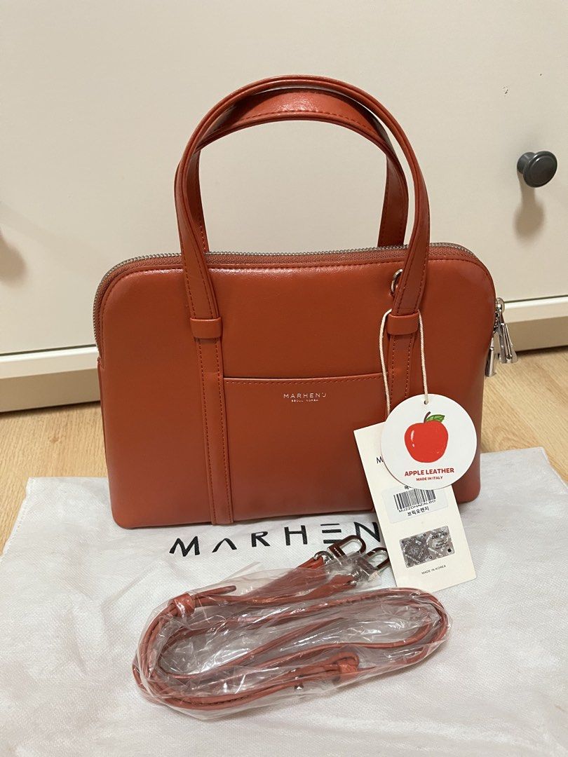 MARHEN.J Hazel Bag in Brick Orange (Category: Luxury Bags & Wallets) located in Pasig City. Submitted by declutterskt (Listing ID 1465040252, Image 1). Description: - Brand: MARHEN.J - Model: Hazel - Color: Brick Orange - Material: Sustainable Italian apple leather - Condition: Brand new, never used, straight out of the box - Features: Top handles, detachable shoulder strap, zip top closure, branded interior lining, and slip pocket - Inclusions: 