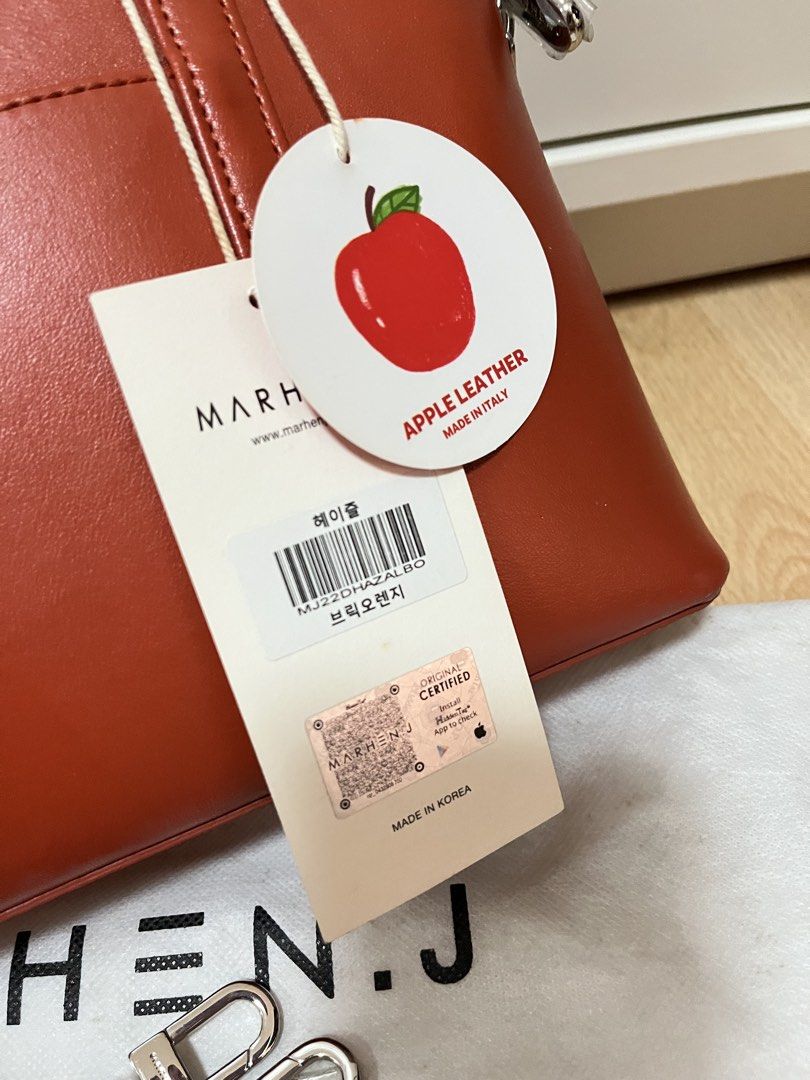 MARHEN.J Hazel Bag in Brick Orange (Category: Luxury Bags & Wallets) located in Pasig City. Submitted by declutterskt (Listing ID 1465040252, Image 3). Description: - Brand: MARHEN.J - Model: Hazel - Color: Brick Orange - Material: Sustainable Italian apple leather - Condition: Brand new, never used, straight out of the box - Features: Top handles, detachable shoulder strap, zip top closure, branded interior lining, and slip pocket - Inclusions: 