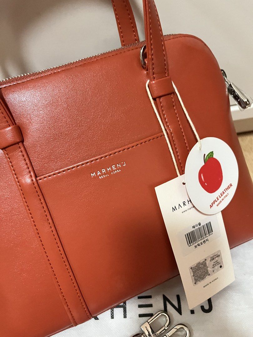 MARHEN.J Hazel Bag in Brick Orange (Category: Luxury Bags & Wallets) located in Pasig City. Submitted by declutterskt (Listing ID 1465040252, Image 2). Description: - Brand: MARHEN.J - Model: Hazel - Color: Brick Orange - Material: Sustainable Italian apple leather - Condition: Brand new, never used, straight out of the box - Features: Top handles, detachable shoulder strap, zip top closure, branded interior lining, and slip pocket - Inclusions: 