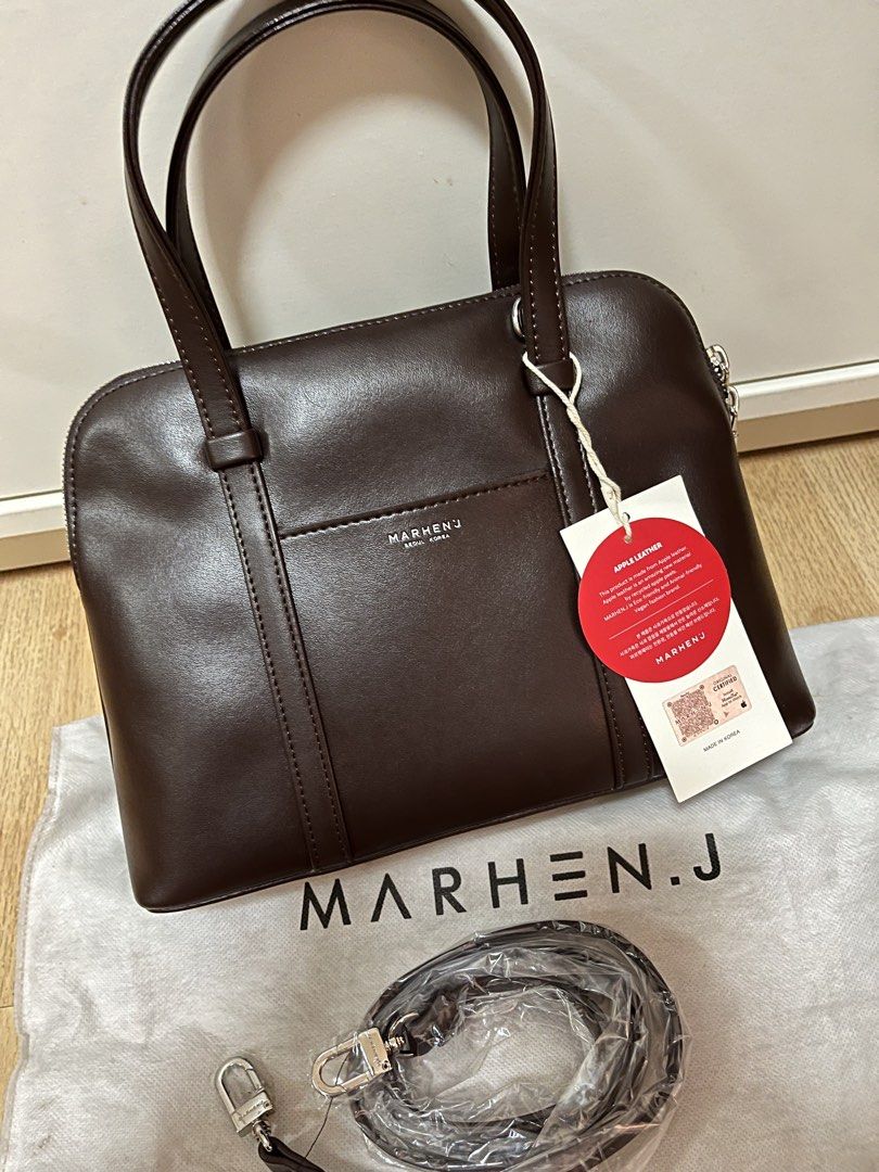 MARHEN.J Hazel Bag in Mocha Brown (Category: Luxury Bags & Wallets) located in Pasig City. Submitted by declutterskt (Listing ID 1465040006, Image 2). Description: - Brand: MARHEN.J - Material: Sustainable apple leather - Origin: Made in Korea - Condition: Brand new, unused, with protective paper stuffing inside - Inclusions: Original dust bag and unopened shoulder strap - Authenticity: Round apple tag and QR authenticity tag attached - Features: