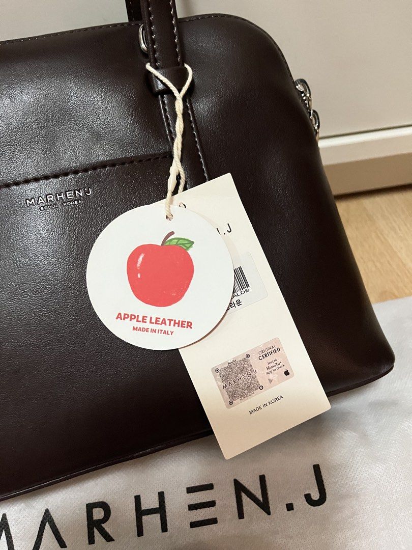 MARHEN.J Hazel Bag in Mocha Brown (Category: Luxury Bags & Wallets) located in Pasig City. Submitted by declutterskt (Listing ID 1465040006, Image 3). Description: - Brand: MARHEN.J - Material: Sustainable apple leather - Origin: Made in Korea - Condition: Brand new, unused, with protective paper stuffing inside - Inclusions: Original dust bag and unopened shoulder strap - Authenticity: Round apple tag and QR authenticity tag attached - Features: