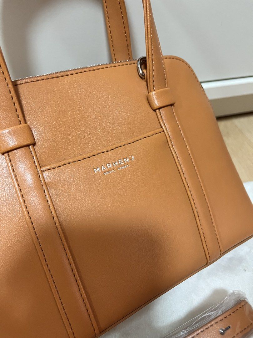 MARHEN.J Hazel Mini Bag in Latte Brown (Category: Luxury Bags & Wallets) located in Pasig City. Submitted by declutterskt (Listing ID 1465039588, Image 3). Description: - Brand: MARHEN.J Hazel Mini Bag - Color: Latte Brown - Material: Sustainable Italian apple leather - Condition: Brand new with original tags and dust bag - Features: Zip closure and top handles - Extras: Matching detachable strap (still sealed in plastic wrapper) - Interior: Clea