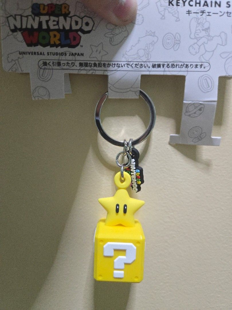 Mario Star Keychain (Category: Character Goods) located in Bulacan. Submitted by kagaminefan02 (Listing ID 1465060422, Image 1). Description: Helping my mom out! (bought from japan trip) Sf shouldered by buyer Issues: paint from age i think (see in pic 2) Mop: Gcash Mod: jnt, gogoxpress, lalamove, meet ups around malolos area.