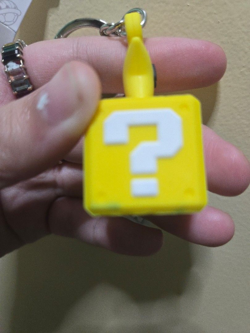Mario Star Keychain (Category: Character Goods) located in Bulacan. Submitted by kagaminefan02 (Listing ID 1465060422, Image 2). Description: Helping my mom out! (bought from japan trip) Sf shouldered by buyer Issues: paint from age i think (see in pic 2) Mop: Gcash Mod: jnt, gogoxpress, lalamove, meet ups around malolos area.