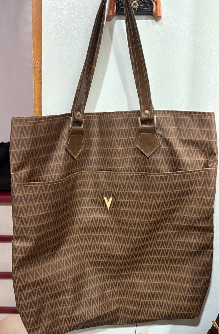 Mario Valentino - totebag (Category: Tote Bags) located in Cavite. Submitted by anything.used (Listing ID 1464990708, Image 1). Description: Preloved totebag - lightweight medium size Can fit laptop 8/10 condition.