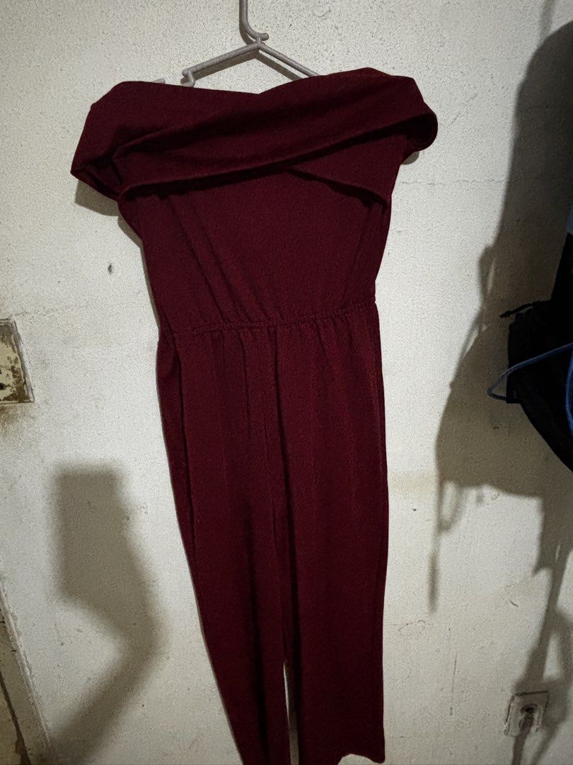 Maroon Off-Shoulder Jumpsuit Size M (Category: Jumpsuits) located in Mabalacat. Submitted by dj10016 (Listing ID 1464995929, Image 1). Description: - Color: Maroon - Size: Medium (tag attached) - Design: Off-shoulder with a chic foldover neckline and straight-leg trousers - Fit: Comfortable elastic waistline - Material: Soft and lightweight fabric - Condition: Worn a couple of times, very well-kept - Ideal for: Evening outings and dinners.