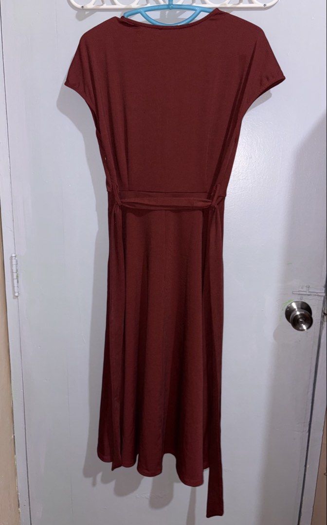 Maroon Wrap Midi Dress with Belt (Category: Dresses) located in Manila. Submitted by margascloset_ (Listing ID 1465078921, Image 2). Description: Maroon Ribbed midi dress with short sleeves and V-neck wrap front - Details: Includes matching waist tie belt and concealed side zipper - Material: Stretchy fabric with fine vertical ribbing - Condition: like new, pre-loved, used only once for an event - bought here in carousell RFS: Decluttering / no l