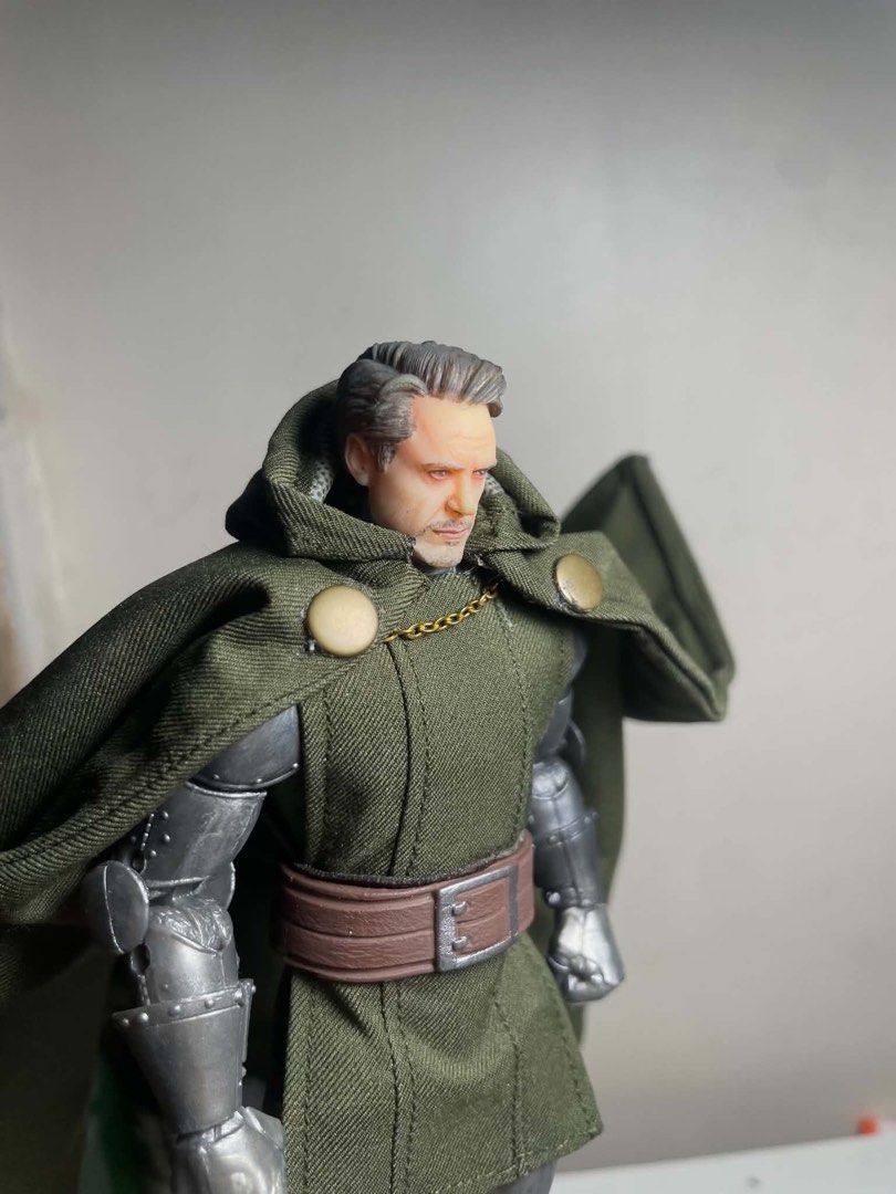 Marvel Legends Doctor Doom Action Figure with Custom Head (Category: Figurines & Statues) located in Manila. Submitted by josegabrie09118 (Listing ID 1465036357, Image 3). Description: - Custom Marvel Legends Doctor Doom action figure - Includes alternate unmasked head sculpt, green soft goods tunic, cape, and magical energy FX parts - Features detailed metallic armor - Perfect for display - Note: Minor glue stain on the fabric tunic..