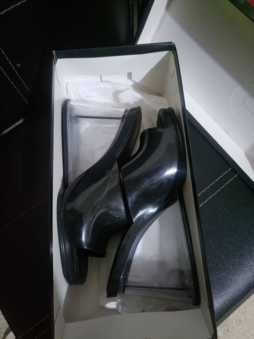 Melissa Queen V Black Mules Wedge Shoes (Category: Flats & Sandals) located in Manila. Submitted by earlco (Listing ID 1465058232, Image 2). Description: - Brand: Melissa - Style: Wedge mules with open toe - Color: Black with clear wedge heel - Size: US 7 / EUR 38 - Material: Vegan (Made in Brazil) - Inclusions: Original black box included.
