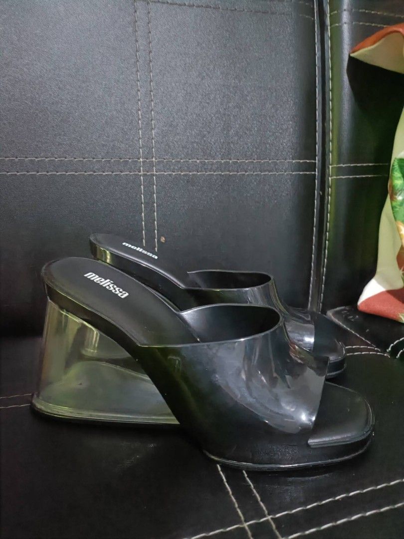 Melissa Queen V Black Mules Wedge Shoes (Category: Flats & Sandals) located in Manila. Submitted by earlco (Listing ID 1465058232, Image 1). Description: - Brand: Melissa - Style: Wedge mules with open toe - Color: Black with clear wedge heel - Size: US 7 / EUR 38 - Material: Vegan (Made in Brazil) - Inclusions: Original black box included.