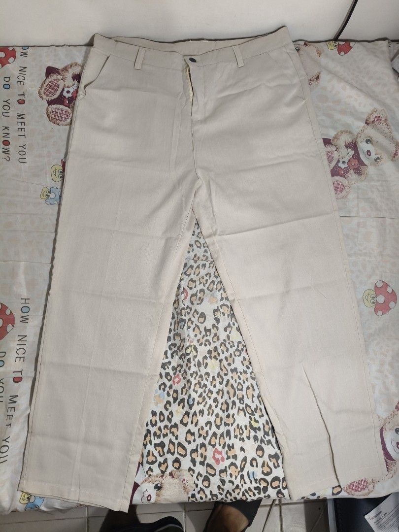 Men's Beige Khaki Pants Trousers (Category: Trousers) located in Lapu Lapu. Submitted by hooman422 (Listing ID 1465073176, Image 1). Description: • Type: Casual/Semi-formal trouser pants • Color: Light beige/Cream • Fit: Straight or slightly relaxed leg • Features: Front button closure, zipper fly, belt loops, slant side pockets, and pressed crease lines along the legs.