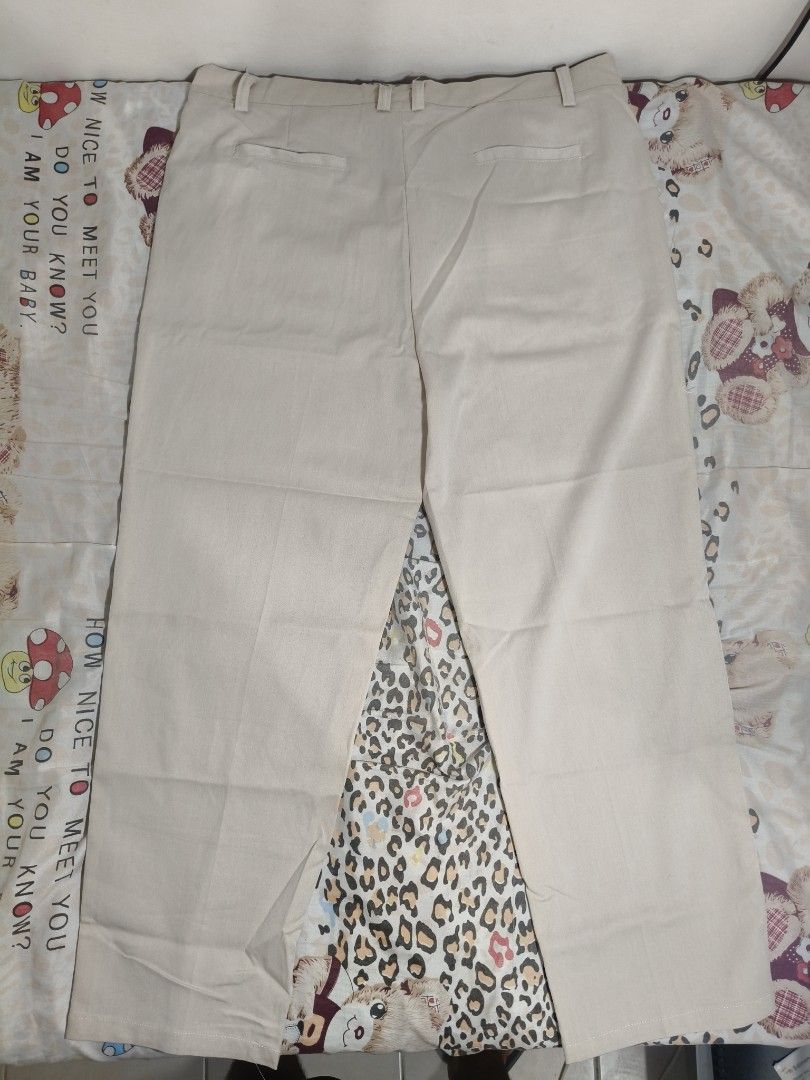 Men's Beige Khaki Pants Trousers (Category: Trousers) located in Lapu Lapu. Submitted by hooman422 (Listing ID 1465073176, Image 3). Description: • Type: Casual/Semi-formal trouser pants • Color: Light beige/Cream • Fit: Straight or slightly relaxed leg • Features: Front button closure, zipper fly, belt loops, slant side pockets, and pressed crease lines along the legs.
