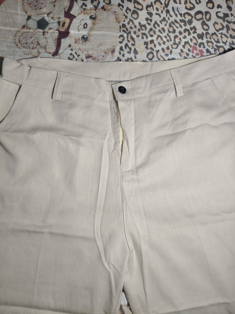 Men's Beige Khaki Pants Trousers (Category: Trousers) located in Lapu Lapu. Submitted by hooman422 (Listing ID 1465073176, Image 2). Description: • Type: Casual/Semi-formal trouser pants • Color: Light beige/Cream • Fit: Straight or slightly relaxed leg • Features: Front button closure, zipper fly, belt loops, slant side pockets, and pressed crease lines along the legs.