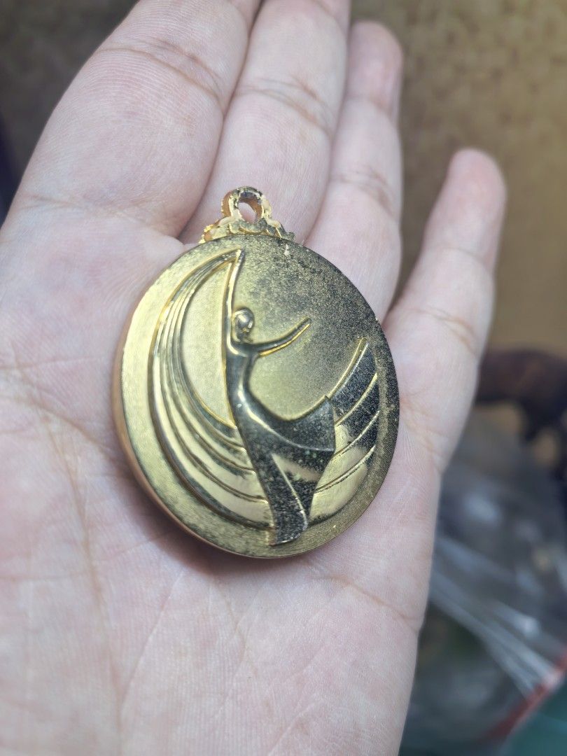 Metal Relief Trophy Insert - Dancer Gold-Tone (Category: Vintage Collectibles) located in Cebu City. Submitted by dudes_villanueva (Listing ID 1464973299, Image 2). Description: Metal Relief Trophy Insert - Dancer Gold-Tone In excellent condition Size: 40mm in diameter.