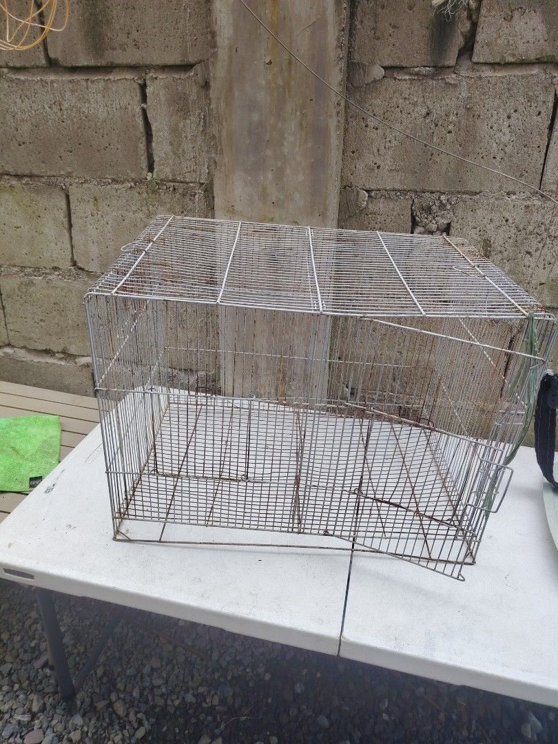 Bird cage small no poop tray (Category: Home Improvement Tools & Accessories) located in Makati City. Submitted by cess_preloved (Listing ID 1464977246, Image 2). Description: - Type: Rectangular metal wire pet cage - Features: Grid flooring, secure front door with latch closure - Condition: Sturdy and functional, with some rust spots from previous use - Maintenance: Needs a quick wash/scrub before use - Ideal for: Small pets or birds - Rall: Bud