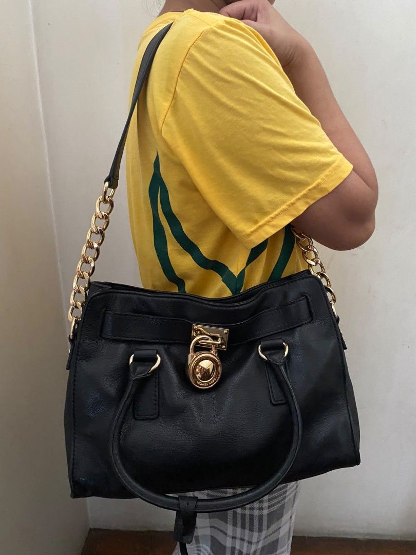 Michael Kors Hamilton Shoulder Bag / Satchel (Authentic) (Category: Shoulder Bags) located in Quezon City. Submitted by mp_simplefinds (Listing ID 1465096362, Image 1). Description: Condition: Excellent / Well-conditioned (No scratches, clean leather, and gold hardware is still shiny) Color: Black with Gold-tone hardware Details: Perfect for everyday use or office bag Very spacious and holds its shape well 100% authentic PM me for more actual pho