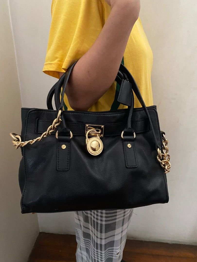 Michael Kors Hamilton Shoulder Bag / Satchel (Authentic) (Category: Shoulder Bags) located in Quezon City. Submitted by mp_simplefinds (Listing ID 1465096362, Image 2). Description: Condition: Excellent / Well-conditioned (No scratches, clean leather, and gold hardware is still shiny) Color: Black with Gold-tone hardware Details: Perfect for everyday use or office bag Very spacious and holds its shape well 100% authentic PM me for more actual pho