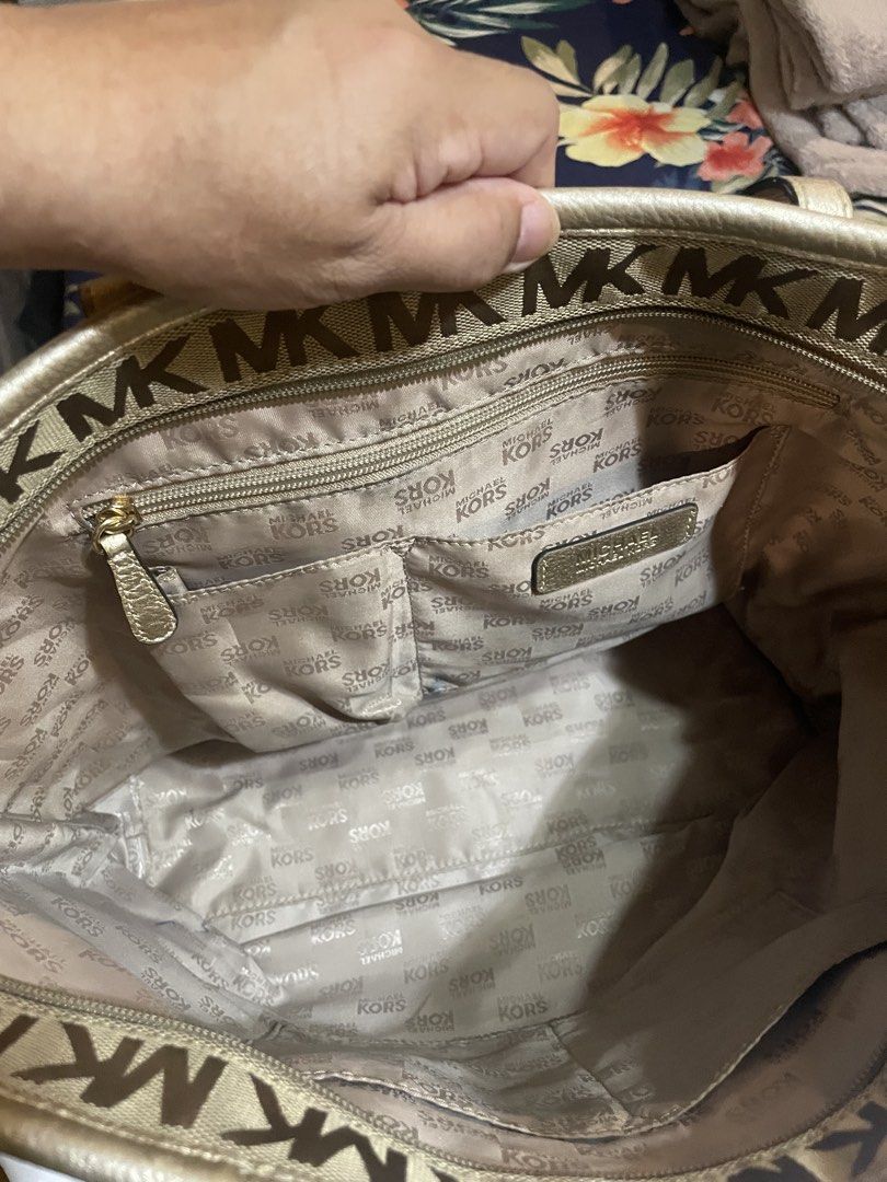 Michael Kors MK Monogram Tote Bag with Dust Bag (Category: Tote Bags) located in Badoc. Submitted by ganalgeral12718 (Listing ID 1465128590, Image 3). Description: - Brand: Michael Kors - Design: Signature MK monogram canvas with gold leather trim - Closure: Secure zip-top closure - Pockets: Outer zippered pocket, multiple interior slip pockets, and one inner zip compartment - Inclusions: Original white Michael Kors dust bag - Condition: Clean in