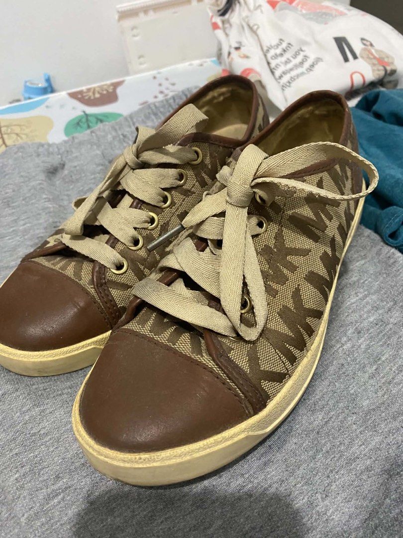 Michael Kors Monogram Sneaker Size 7 (Category: Tote Bags) located in Manila. Submitted by harvey2417 (Listing ID 1465116023, Image 1). Description: - Michael Kors monogram sneakers Size 7 - Sneakers: Brown monogram fabric, leather toe caps, and wide laces - Great for daily outfits and effortless styling - Special bundle deal - grab both items together now! - Used Once, from USA ORIGINAL PRICE ₱17k.