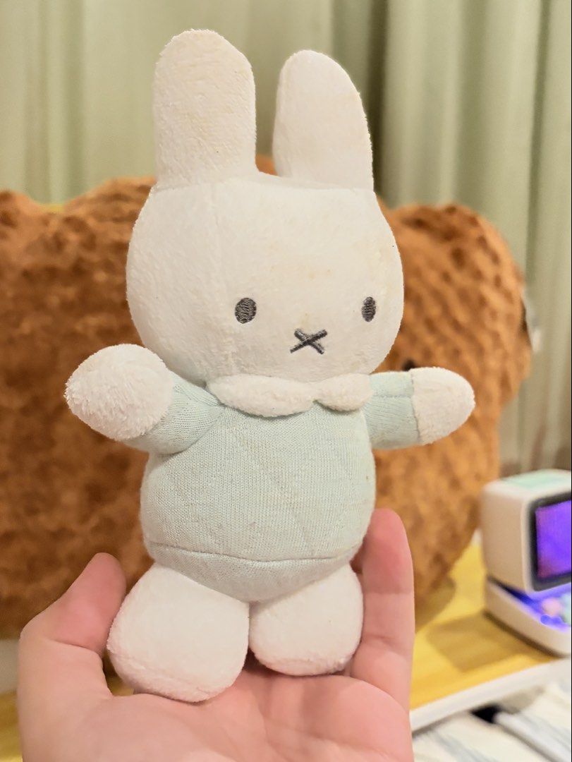 Miffy Plush (Rattle) (Category: Plushies & Soft Toys) located in Caloocan City. Submitted by miffuph (Listing ID 1465127428, Image 2). Description: - 100% Authentic Miffy plush from the Tiamo collection - Outfit: Light mint green quilted dress with a white collar - Condition: Brand new with original tag attached; has minor storage discoloration on the top of the head and ears - Material: Super soft and huggable all around - Perfect addition to yo