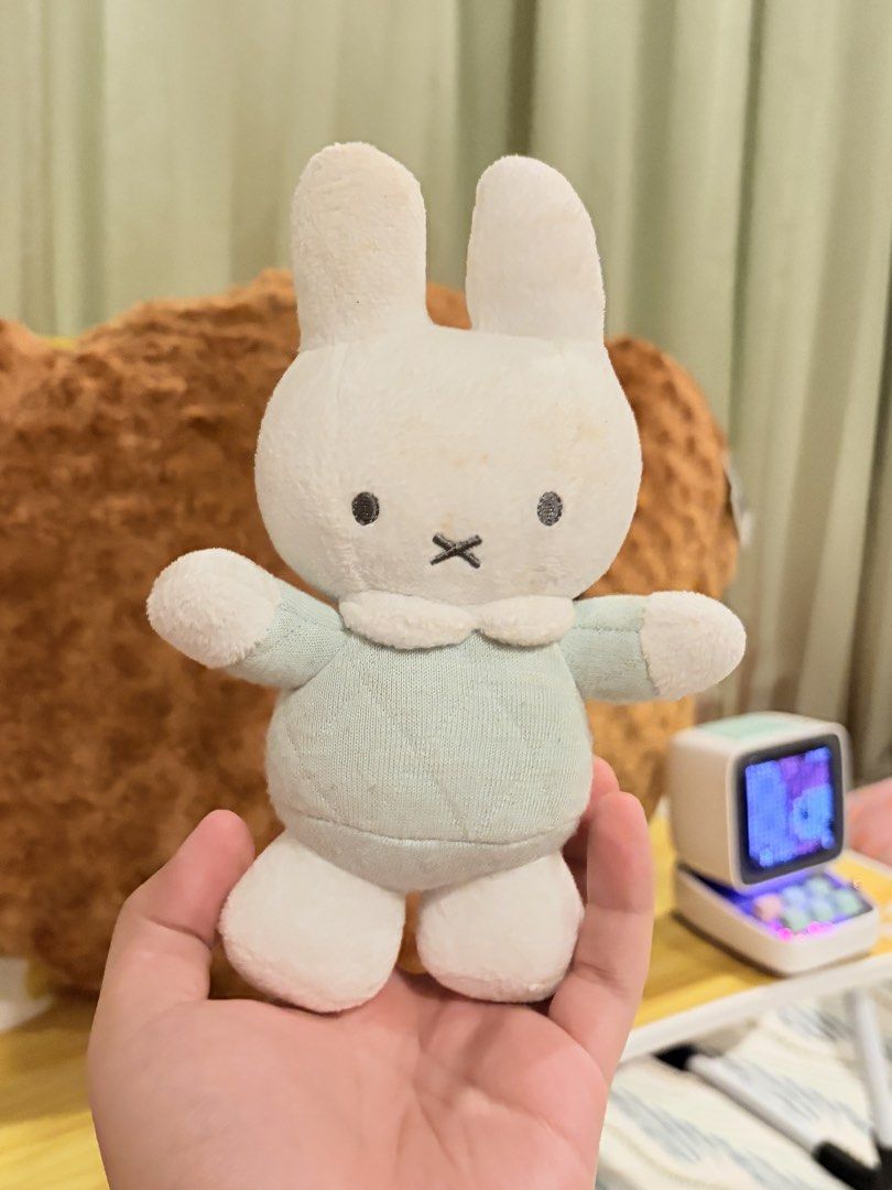 Miffy Plush (Rattle) (Category: Plushies & Soft Toys) located in Caloocan City. Submitted by miffuph (Listing ID 1465127428, Image 1). Description: - 100% Authentic Miffy plush from the Tiamo collection - Outfit: Light mint green quilted dress with a white collar - Condition: Brand new with original tag attached; has minor storage discoloration on the top of the head and ears - Material: Super soft and huggable all around - Perfect addition to yo