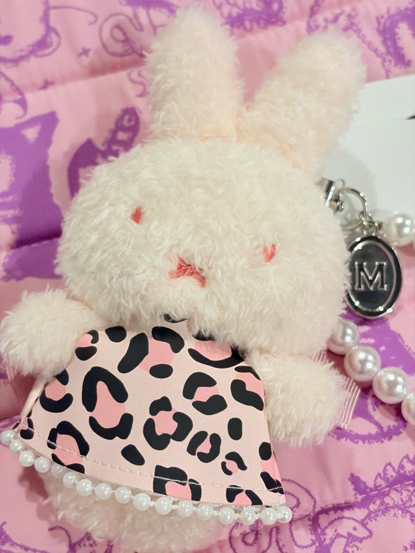 MIIA Miffy Plush Keyring with Pearl Strap (Category: Plushies & Soft Toys) located in Caloocan City. Submitted by miffuph (Listing ID 1465127404, Image 2). Description: - Brand: MIIA - Item: Fluffy bunny plush keychain - Outfit: Pink leopard print dress with a large bow on the back - Accessories: White pearl strap handle and branded silver charm tag - Condition: Brand new with original tags still attached.