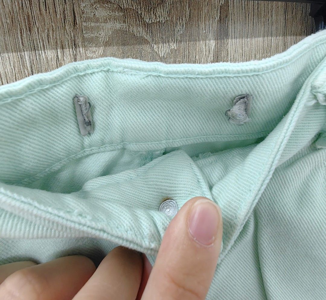 Mint green denim distressed shorts (Category: Shorts) located in Las Pinas. Submitted by offtonewhome (Listing ID 1465019244, Image 2). Description: - Mint green pastel denim shorts - Distressed rips on both legs with raw frayed hem - Button and zipper fly closure - Adjustable inner waistband tabs on both sides for a customized fit - Waist: approx. 14 inches flat | Length: approx. 9 inches - Lightweight and comfortable cotton denim fabric.