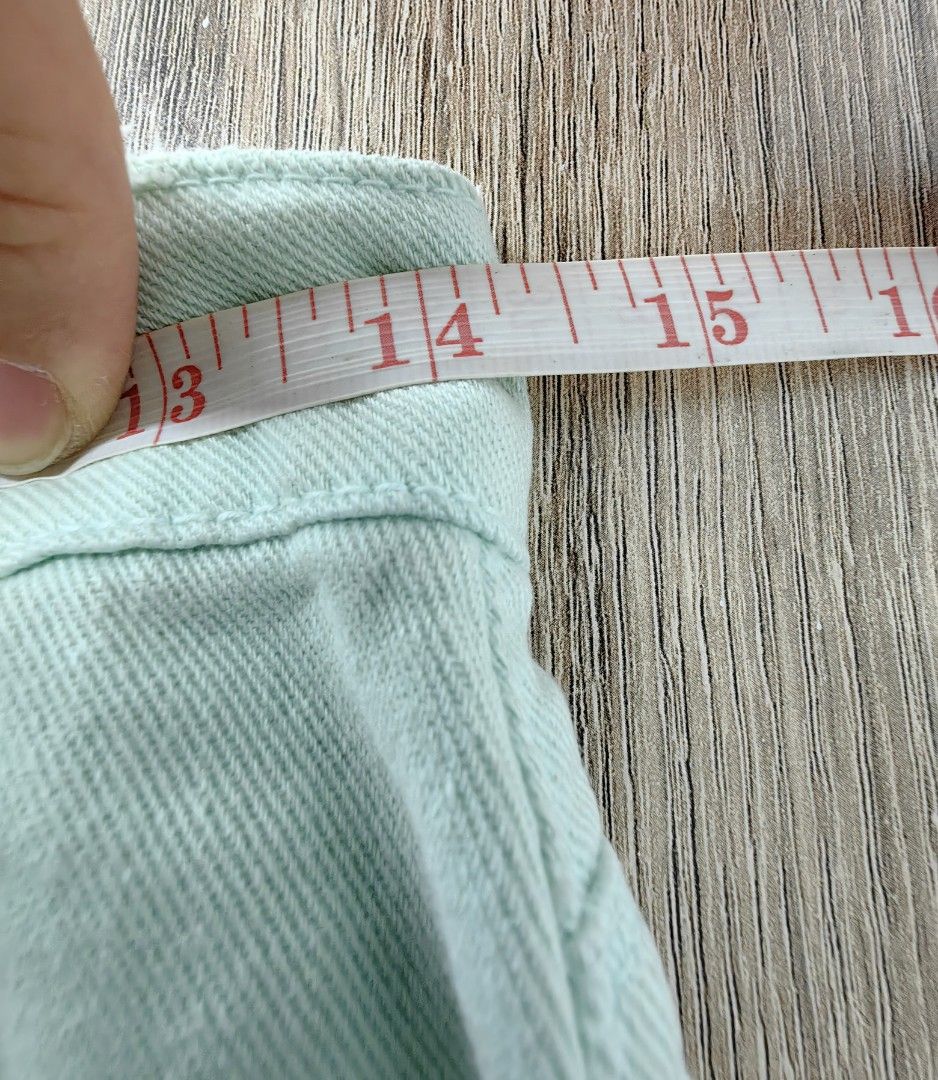Mint green denim distressed shorts (Category: Shorts) located in Las Pinas. Submitted by offtonewhome (Listing ID 1465019244, Image 3). Description: - Mint green pastel denim shorts - Distressed rips on both legs with raw frayed hem - Button and zipper fly closure - Adjustable inner waistband tabs on both sides for a customized fit - Waist: approx. 14 inches flat | Length: approx. 9 inches - Lightweight and comfortable cotton denim fabric.